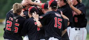 Milan High School baseball players mob their pitcher sophomore Thomas Lindeman as they celebrate beating Coldwater, 1-0, during the MHSAA baseball quarterfinals at Nichols Field at Bailey Park in Battle Creek on Tuesday, June 11, 2013. Melanie Maxwell | AnnArbor.com